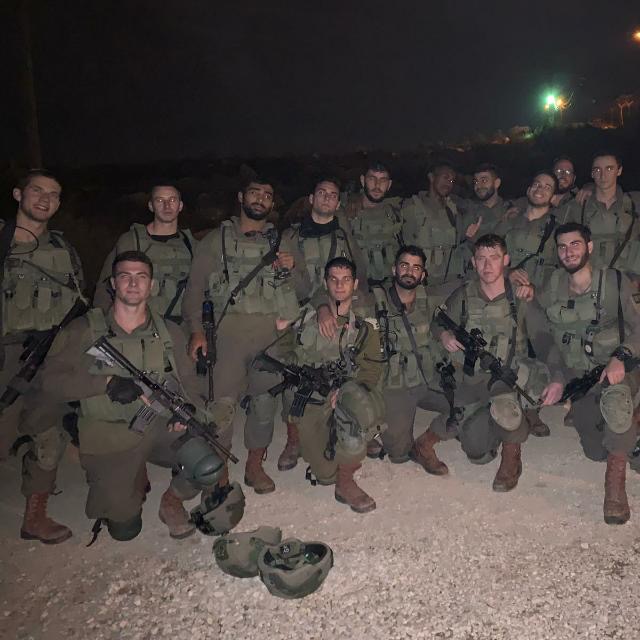 Members of Tzevet Efrati serving together at night